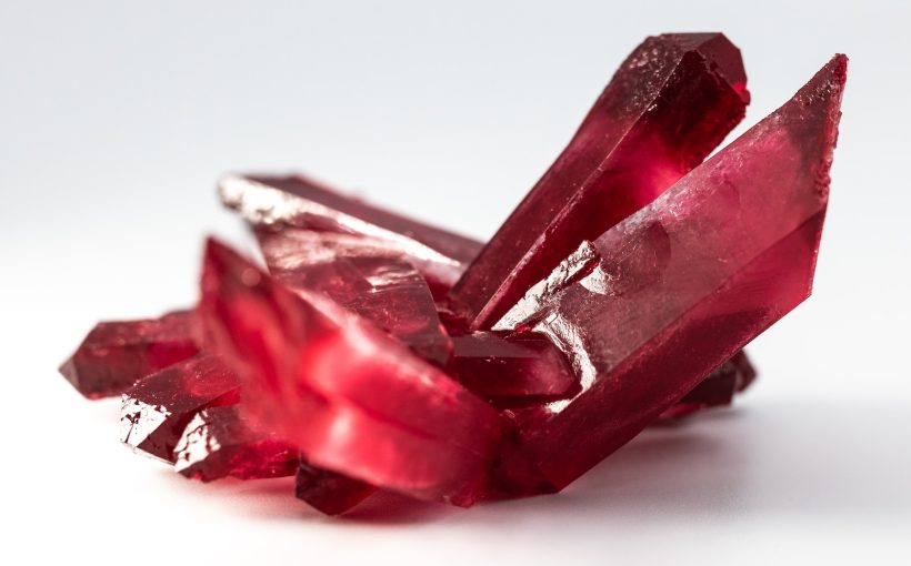 selective focus photo of red gemstone